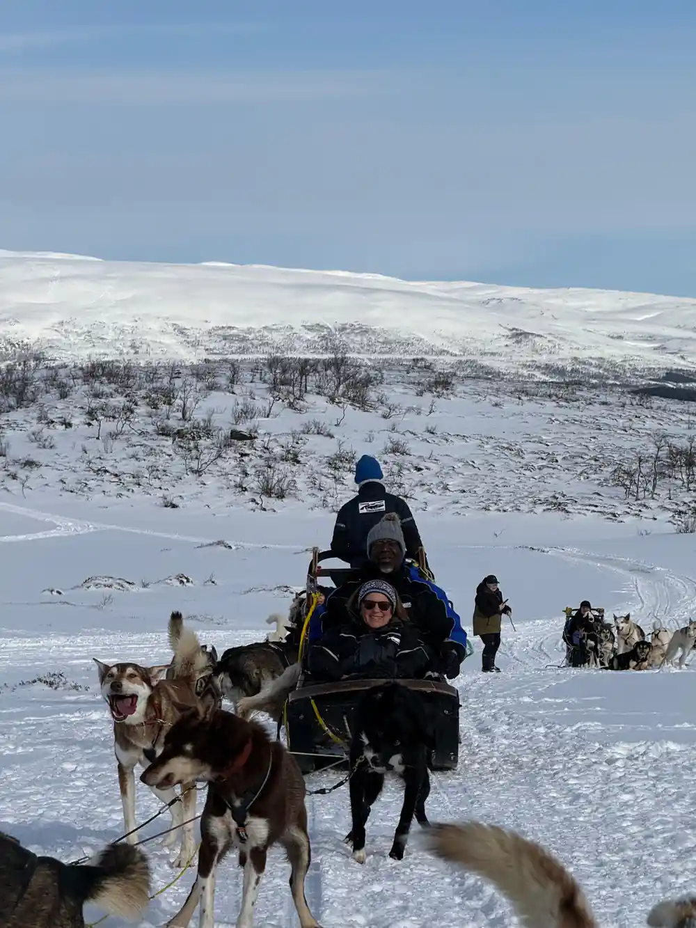A driver and passengers setting off from the camp